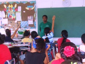 4-H Extension Agent, Martin Ruwniyol in the classroom giving a lecture on nutrition.